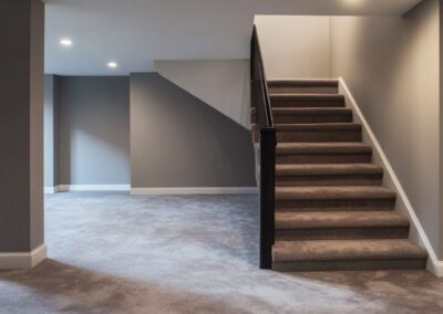 basement with carpet no windows with staircase
